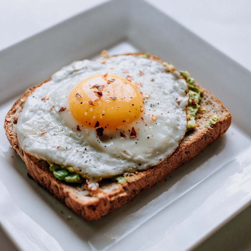 Sunny-side up eggs with runny yolks and crispy toast