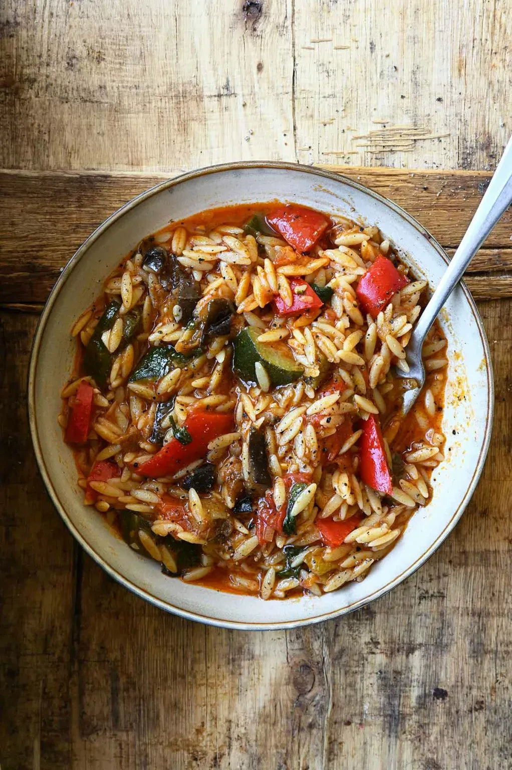 Ratatouille orzo with zucchini, tomatoes, and fresh herbs
