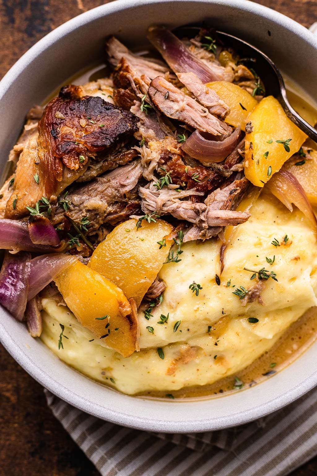 Apple cider braised pork chops with caramelized onions